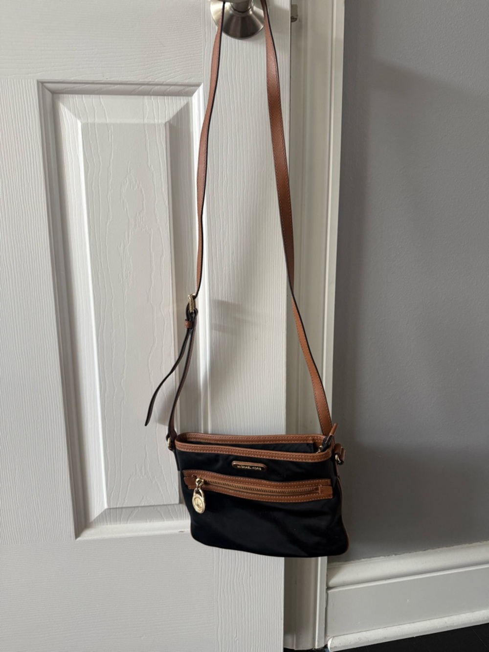 Michael Kors Kempton crossbody. Black nylon with brown trim.